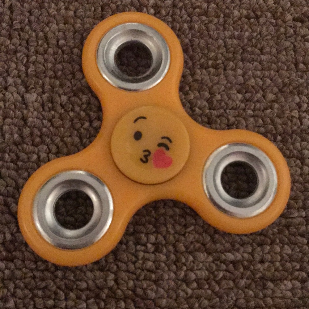 An emoji double sided fidget spinner